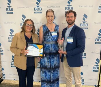Stephanie Bolton holding BBB Award for Ethics